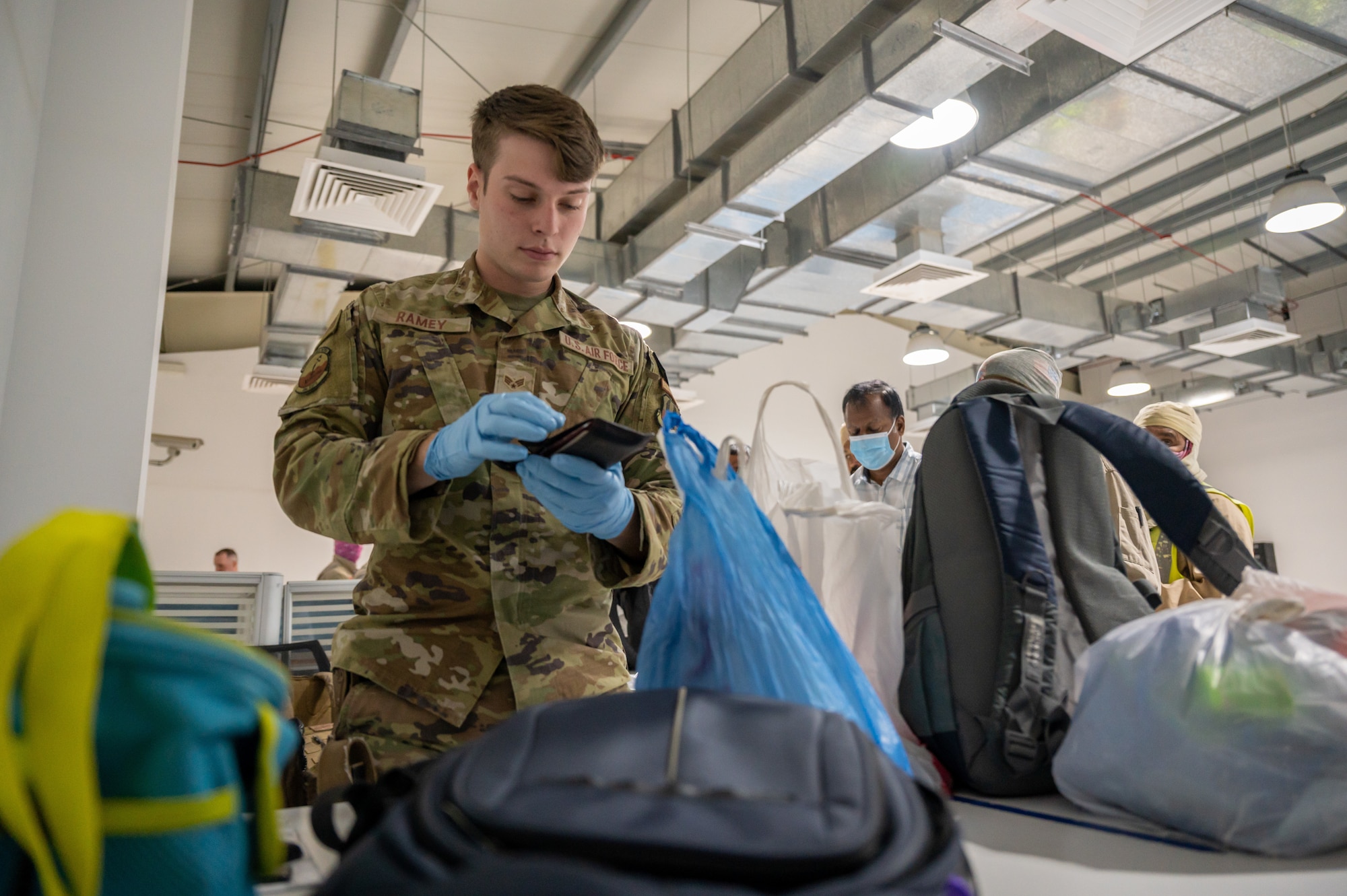 As a first line of defense, entry controllers from the 386th Expeditionary Security Forces Squadron screen the belongings of approximately 550 to 650 other country nationals on a daily basis.