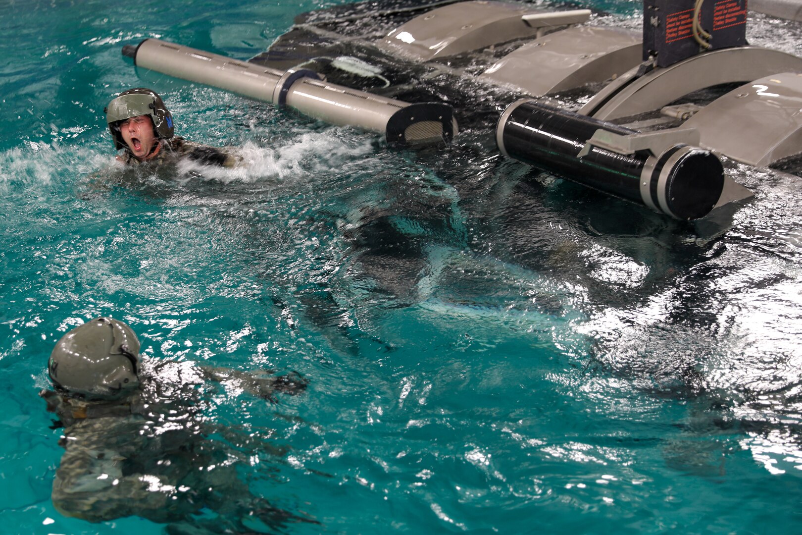 Kentucky Army National Guard Soldiers with the 63rd Theater Aviation Brigade take part in dunker qualification at Ft. Campbell, Ky., Apr. 6-7, 2022. The training prepares helicopter pilots and crew members to escape from a submerged helicopter.