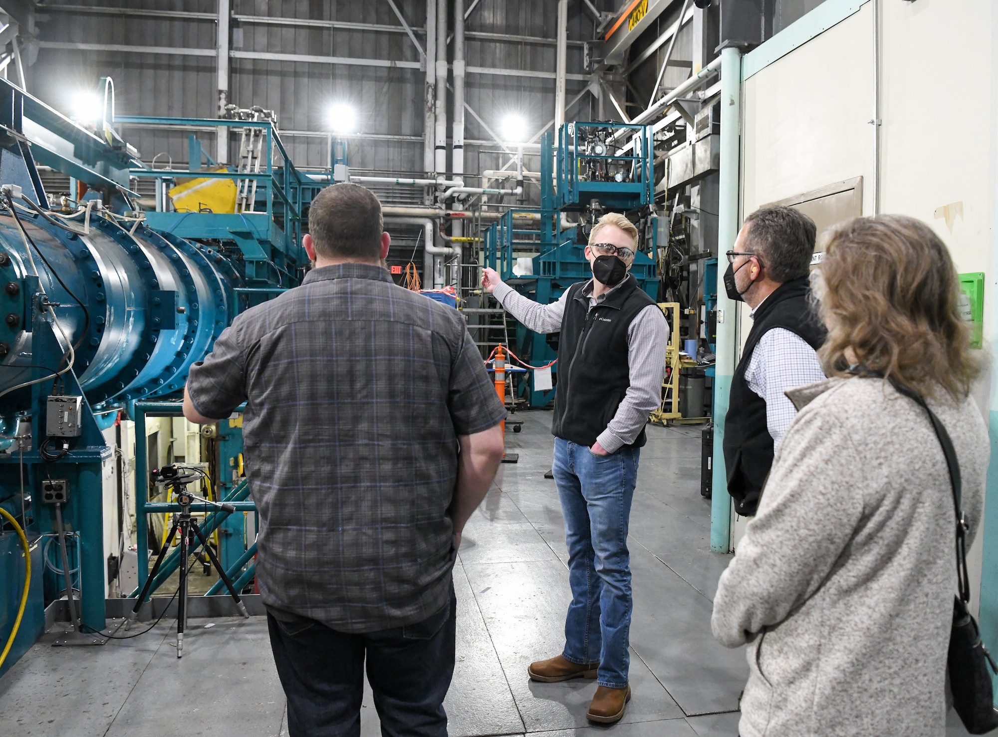 Brandon Anderson, center, the von Kármán Gas Dynamics Facility (VKF) Test Section manager for the Test Operations and Sustainment contractor for Arnold Engineering Development Complex, explains how one of the wind tunnels in VKF works during a tour of facilities at Arnold Air Force Base, Tenn., Feb. 23, 2022, for local teachers and administrators. The educators were being shown the trade job opportunities available at the base to be able to share the information with their students. (U.S. Air Force photo by Jill Pickett)