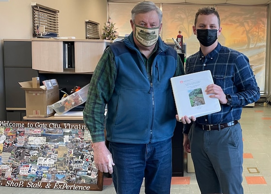 Gate City Mayor Bob Richards meets with Mark Veasey, technical lead engineer, on February 2, 2022, for a formal handover of the FPMS project report in Gate City, Virginia.