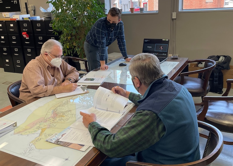 Technical Lead Engineer Mark Veasey goes over the FMPS project report for Gate City with Town Manager Greg Jones and Mayor Bob Richards as they plan their next meeting for the presentation at the Gate City Town Hall.
