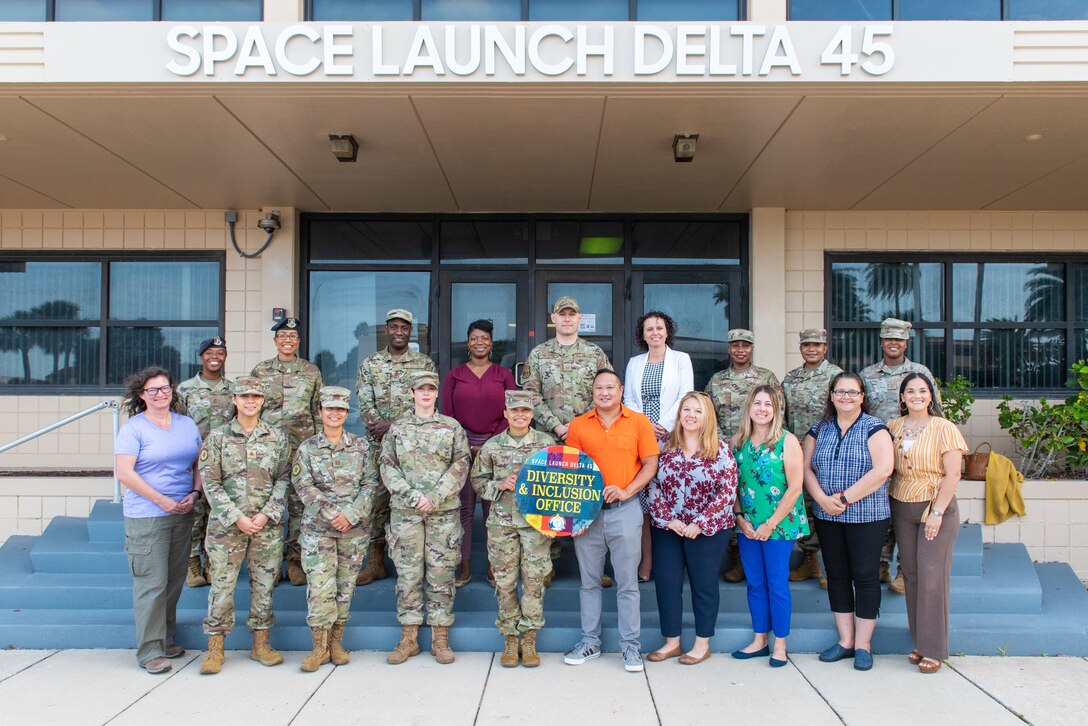 The Space Launch Delta 45 Diversity & Inclusion office poses for a group photo at Patrick Space Force Base, Fla., April 21, 2022. SLD 45 made history October 25, 2021, as it became one of the first Deltas in the U.S. Space Force to stand up a full time position dedicated to diversity and inclusion. (U.S. Space Force photo by Amanda Ryrholm)