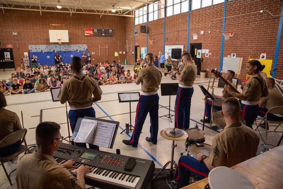 Students of Brinson Memorial Elementary School watch as U.S. Marines from the 2nd Marine Aircraft Wing (MAW) Band perform at Brinson Memorial Elementary School, New Bern, North Carolina, April 13, 2022. The 2nd MAW Band gave a music clinic to the students in order to educate them on the different instruments and performed various music pieces. (U.S. Marine Corps photo by Sgt. Christian J. Lopez)