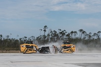 U.S. Air Force Airmen use compact track loaders attached with skid steer saws to remove damaged concrete on the runway during RADR (Rapid Airfield Damage Repair) operations at the Silver Flag exercise site on Tyndall Air Force Base, Florida, March 31, 2022. The primary focus of Silver Flag is to teach Airmen from the civil engineer, force support, and vehicle maintenance squadrons essential skills to complete operations outside of their primary duties. (U.S. Air National Guard photo by Senior Airman Jana Somero)