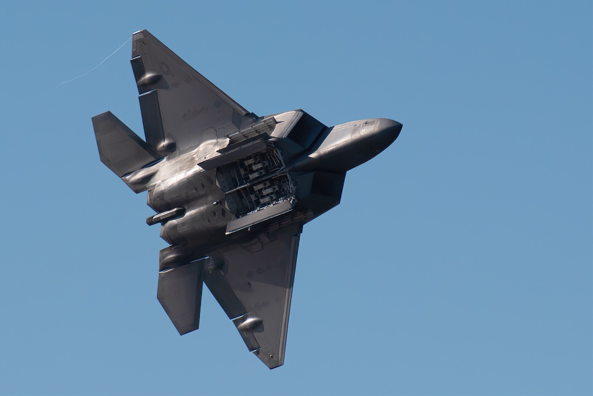 The U.S. Air Force F-22 Raptor Demo Team from the 1st Fighter Wing at Langley Air Force Base, Va., performs an aerial demonstration over the Ohio River in downtown Louisville, Ky., April 23, 2022 as part of the Thunder Over Louisville air show. This year’s event celebrated the 75th anniversary of the United States Air Force. (U.S. Air National Guard photo by Dale Greer)