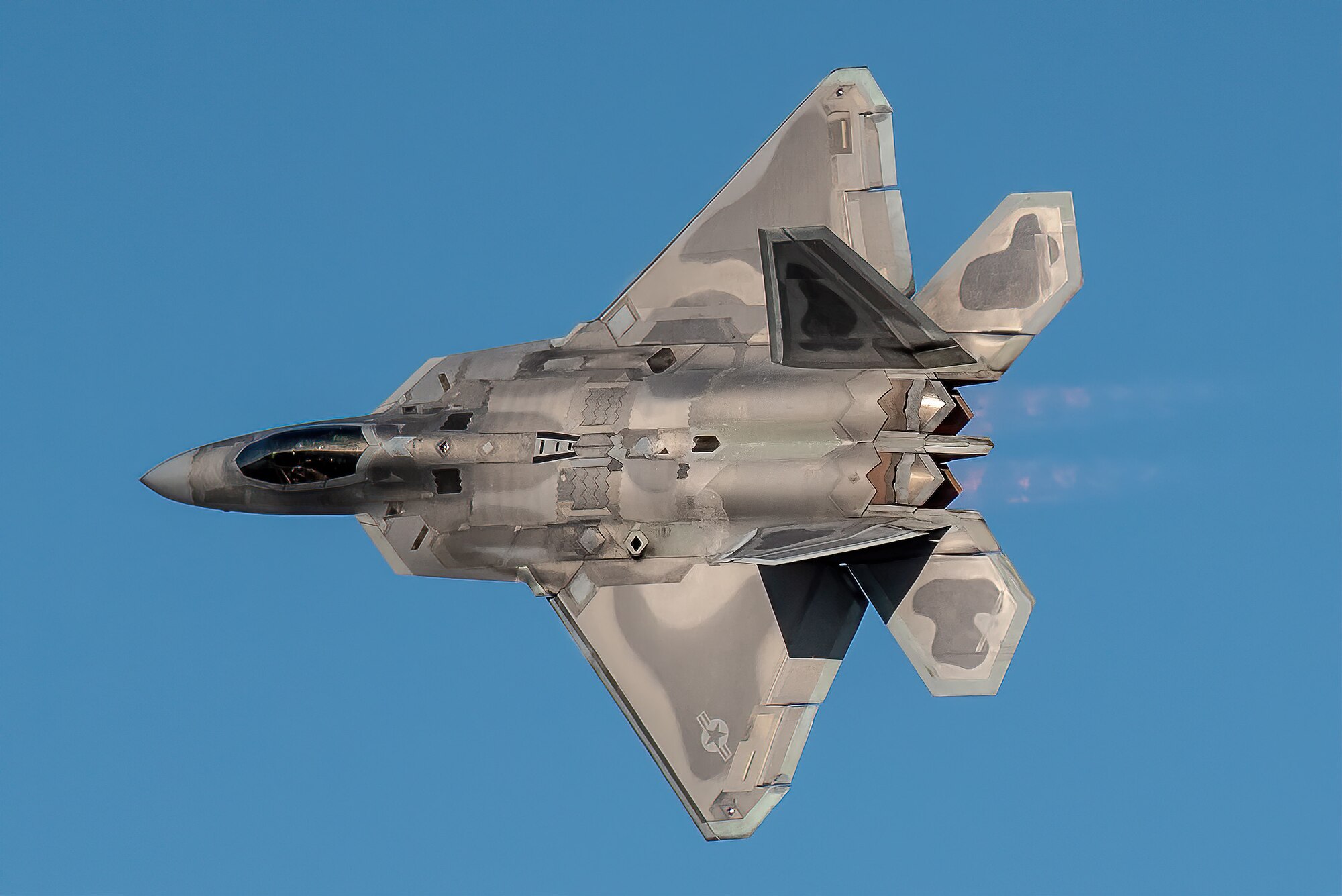 The U.S. Air Force F-22 Raptor Demo Team from the 1st Fighter Wing at Langley Air Force Base, Va., performs an aerial demonstration over the Ohio River in downtown Louisville, Ky., April 23, 2022 as part of the Thunder Over Louisville air show. This year’s event celebrated the 75th anniversary of the United States Air Force. (U.S. Air National Guard photo by Dale Greer)