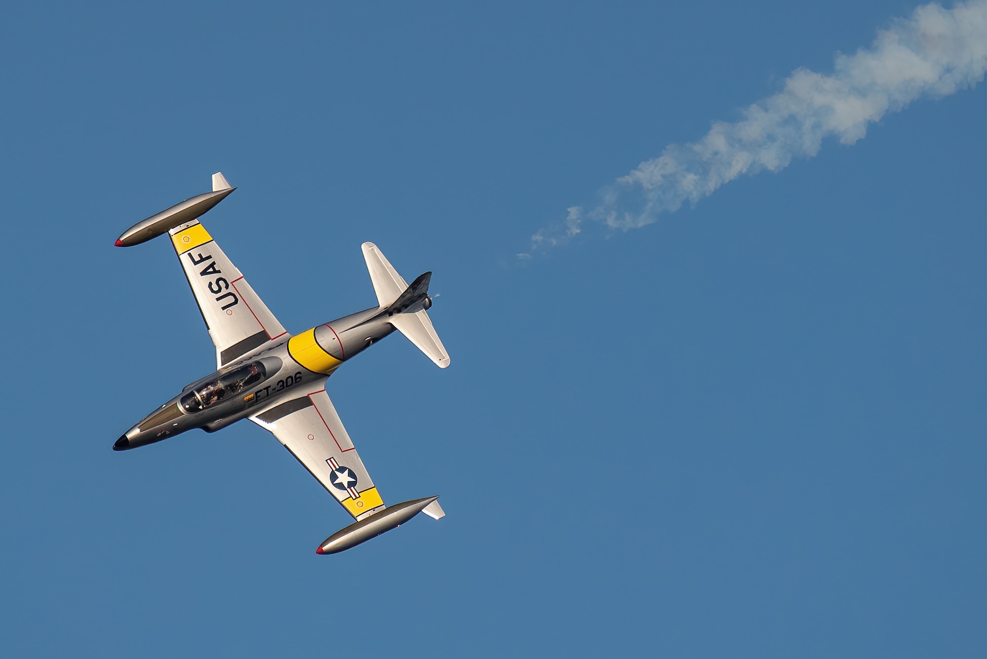 A T-33 Shooting Star from Acemaker Airshows performs an aerial demonstration over the Ohio River in downtown Louisville, Ky., April 23, 2022 as part of the Thunder Over Louisville air show. This year’s event celebrated the 75th anniversary of the United States Air Force. (U.S. Air National Guard photo by Dale Greer)