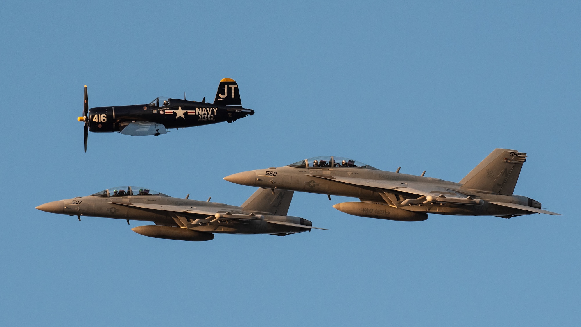 A heritage flight consisting of a World War II-era F-4U Corsair and two modern U.S. Navy E/A-18G Growlers from Whidbey Island Naval Air Station, Wash., performs an aerial demonstration over the Ohio River in downtown Louisville, Ky., April 23, 2022 as part of the Thunder Over Louisville air show. This year’s event celebrated the 75th anniversary of the United States Air Force. (U.S. Air National Guard photo by Dale Greer)