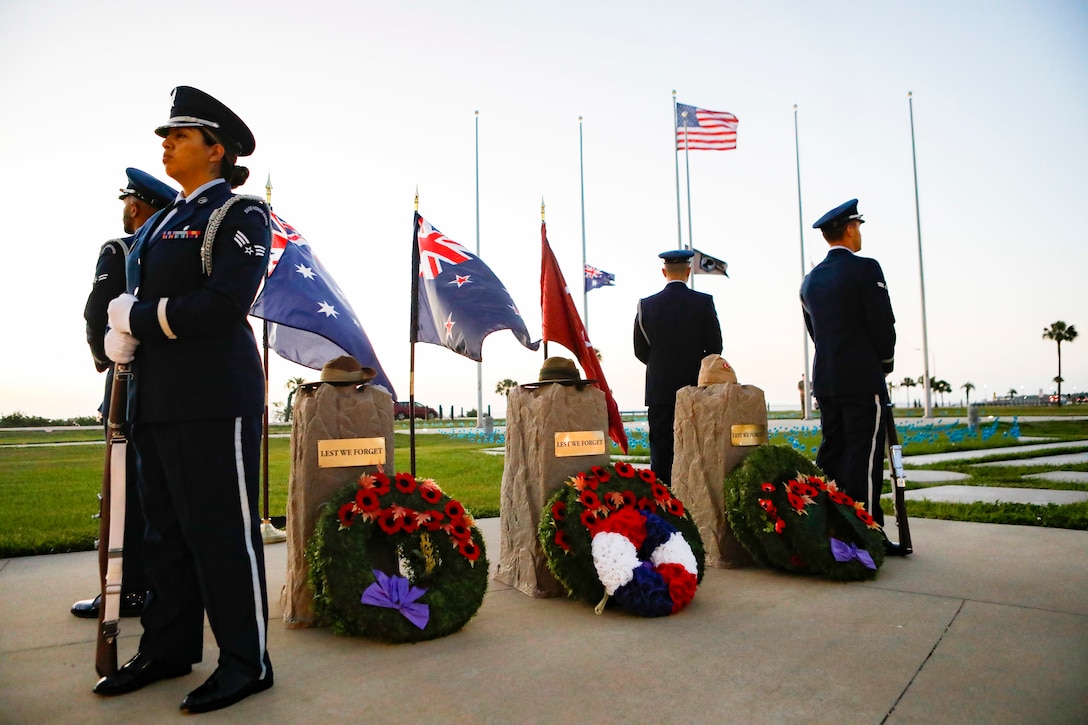 TAMPA, Fla. – Airmen from the MacDill Air Force Base Honor Guard stand at parade rest around a memorial during an ANZAC Day dawn service at MacDill Air Force Base, April 25, 2022. Though repelled by Ottoman forces, Australian and New Zealand Army Corps (ANZAC) Day commemorates the World War I campaign when Australian and New Zealand forces stood together in effort to capture the Gallipoli Peninsula. ANZAC Day is a day of remembrance in Australia and New Zealand to honor those who served and died in military operations. (U.S. Central Command Public Affairs photo by Tom Gagnier)