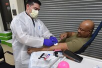 Sgt.1st Class Lonnie Cavitt, G3 Operations Sergeant, 85th Army Reserve Support Command, donates blood during an Armed Services Blood Program event.
