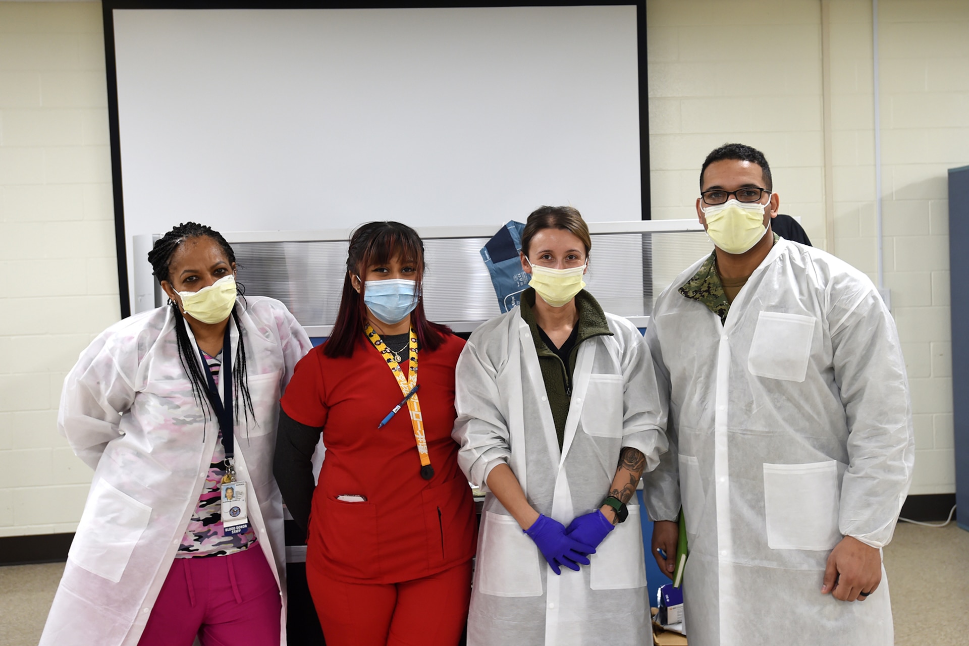 Staff from the Armed Service Blood Program pause for a photo during a blood drive event.