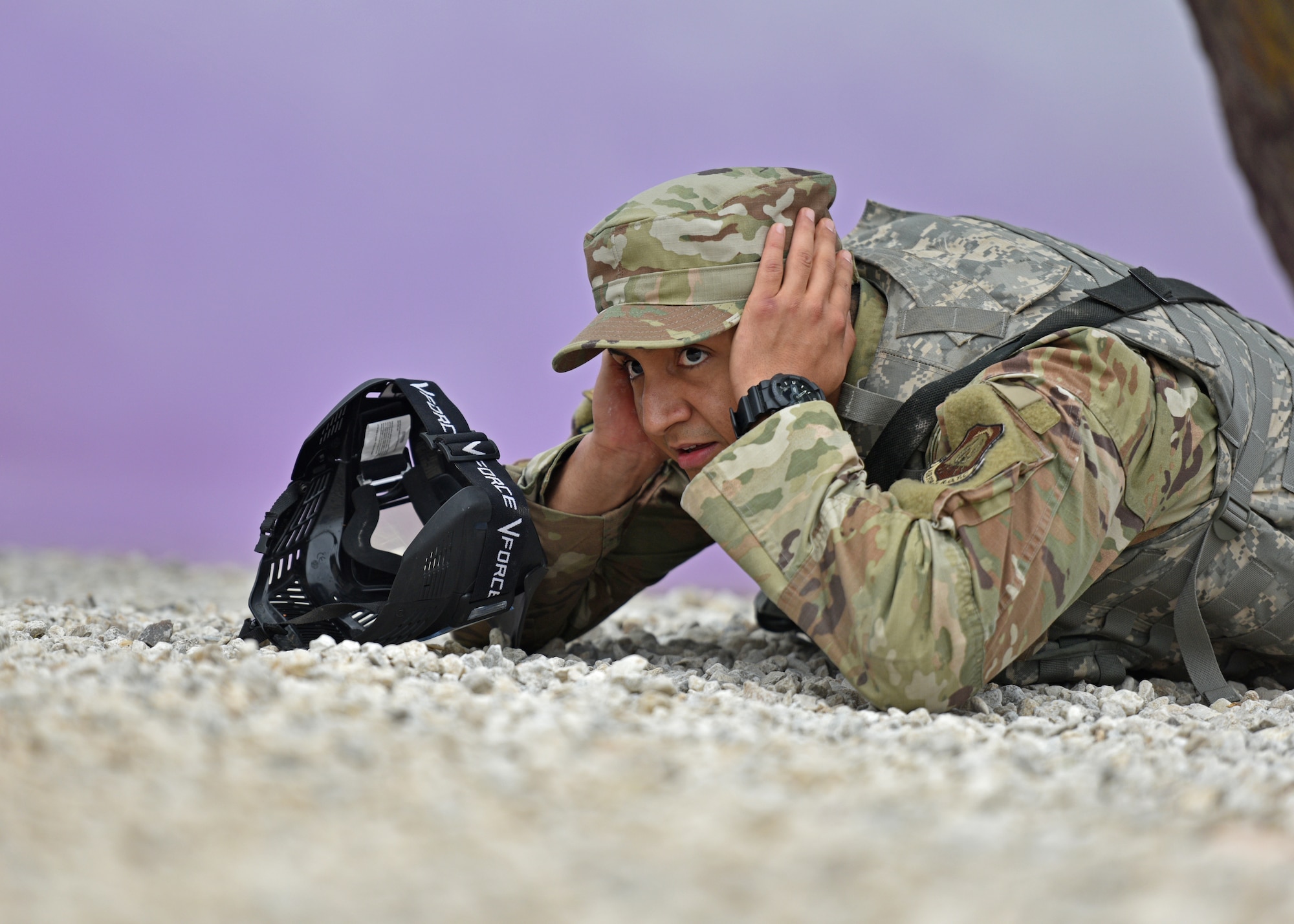 An Angelo State University Air Force Reserve Officers’ Training Corps cadet takes cover during a field training exercise at Goodfellow Air Force Base, Texas, April 22, 2022. Smoke simulated a real world mortar attack and was used to observe how the cadets would respond. (U.S. Air Force photo by Senior Airman Ashley Thrash)