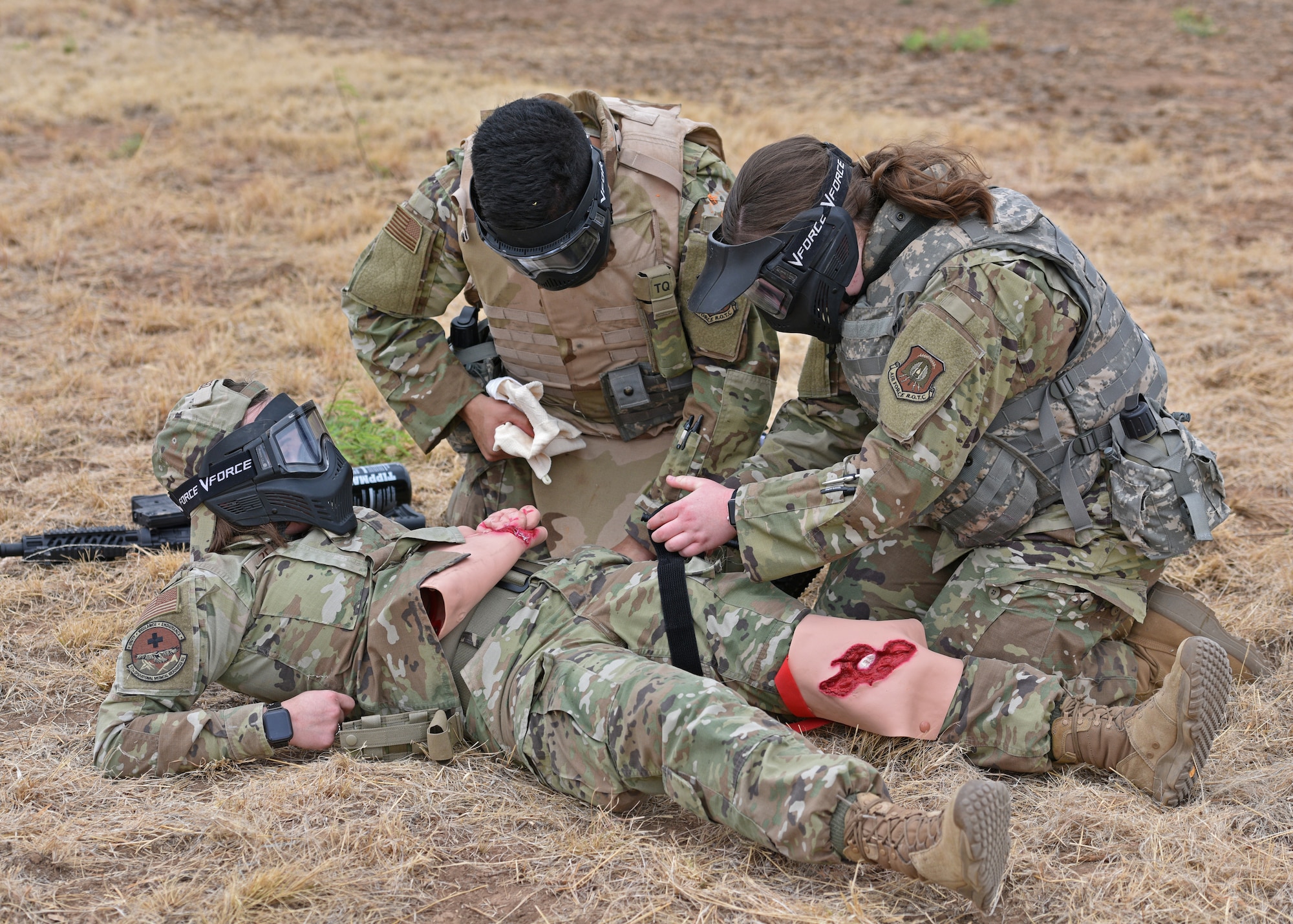 Angelo State University Air Force Reserve Officers’ Training Corps cadets provide simulated first aid during a training exercise at Goodfellow Air Force Base, Texas, April 22, 2022. Cadets were given various roles such as medics, squad leaders and other leadership positions throughout the exercise. (U.S. Air Force photo by Senior Airman Ashley Thrash)