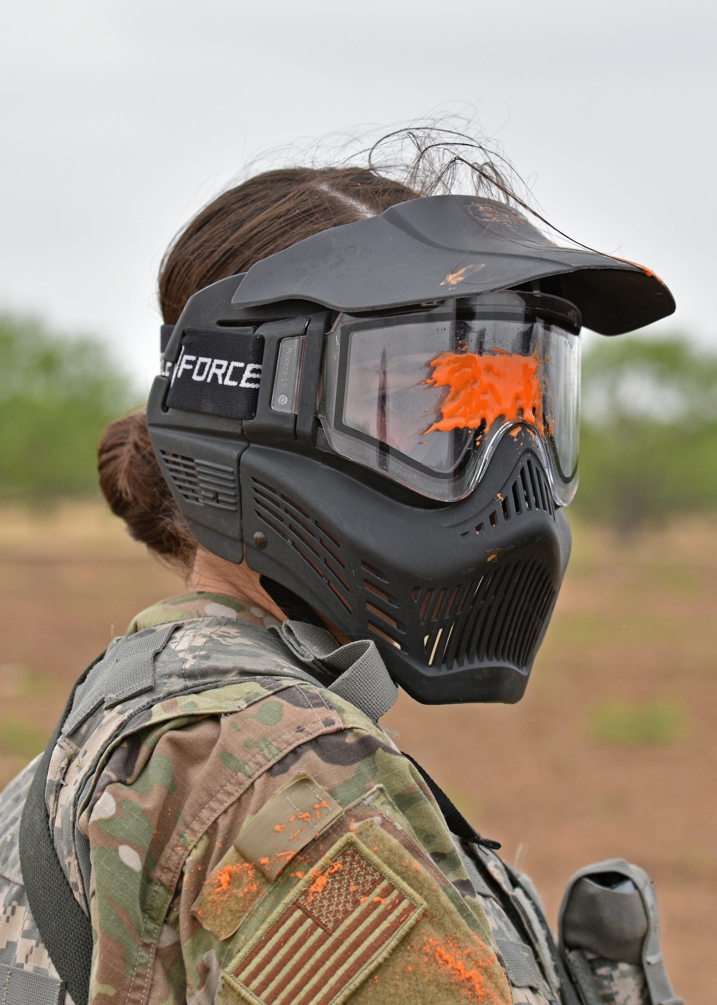 An Angelo State University Air Force Reserve Officers’ Training Corps Cadet listens to a debrief during a field training exercise at Goodfellow Air Force Base, Texas, April 22, 2022. While at Forward Operating Base Sentinel, the cadets were given various scenarios throughout the exercise to put their combat readiness knowledge and first aid to the test. (U.S. Air Force photo by Senior Airman Ashley Thrash)