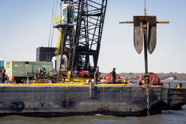 Maritime response assets retrieve an anchor during dredging operations surrounding the box ship EVER FORWARD near Annapolis, Md., April 20, 2022. East Coast maritime response assets delivered support to ensure the site and surrounding waterways were safely, efficiently, and environmentally operational to benefit the Nation’s marine transportation system. (U.S. Army photo by Greg Nash)