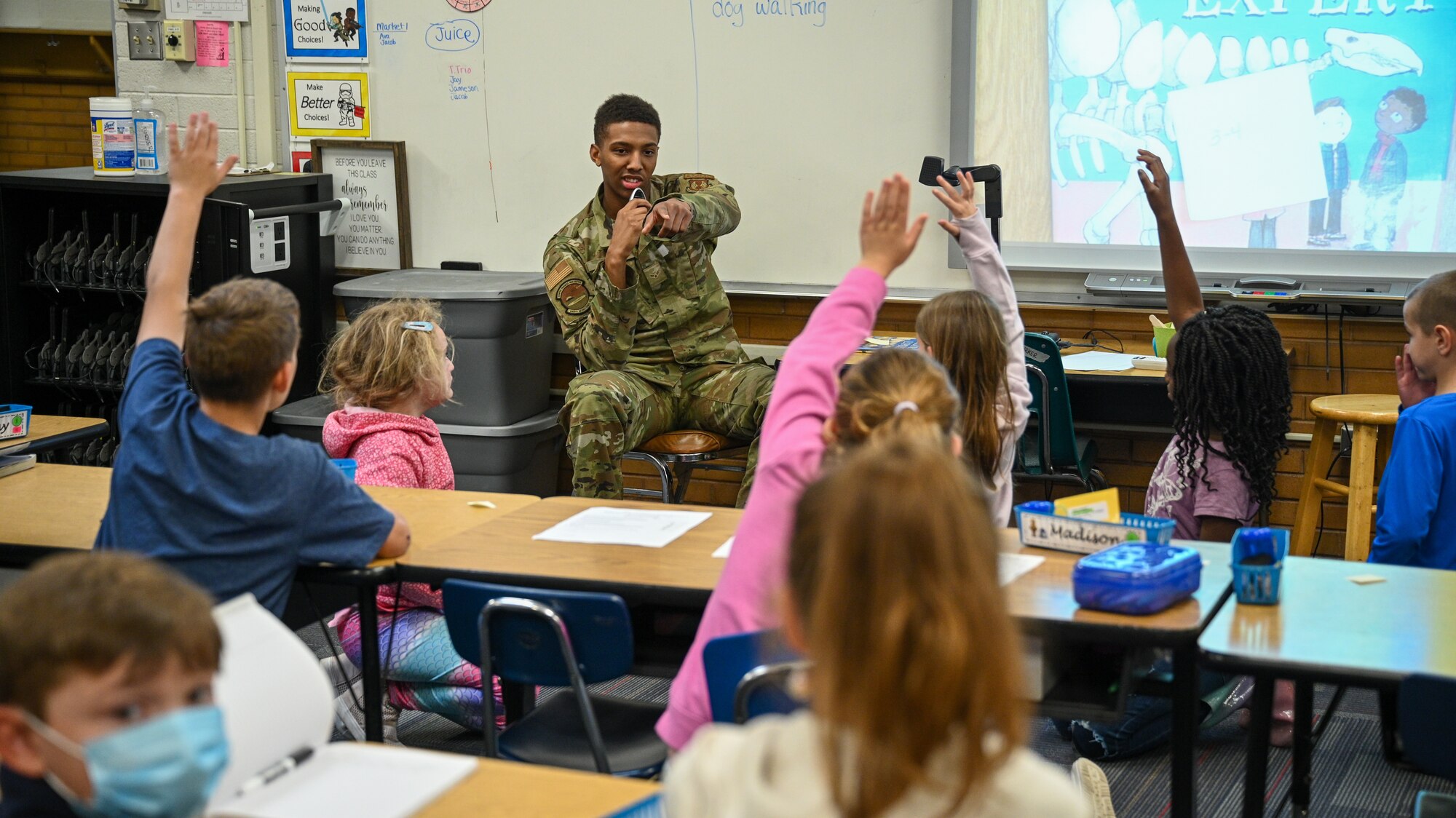 Airman 1st Class Coleman Wood, 649th Munitions Squadron, takes questions from students at Hill Field Elementary School during a Heroes Reading event, April 22, 2022. The Heroes Reading program is an annual event conducted by the Hill AFB School Liaison office in partnership with local elementary schools. The event is held each spring in conjuction with April's Month of the Military Child. This year marks a relaunch of the program after a hiatus due to the COVID-19 pandemic. During the month, Airmen volunteers will visit three schools and read to more than 1,400 students. (U.S. Air Force photo by R. Nial Bradshaw)