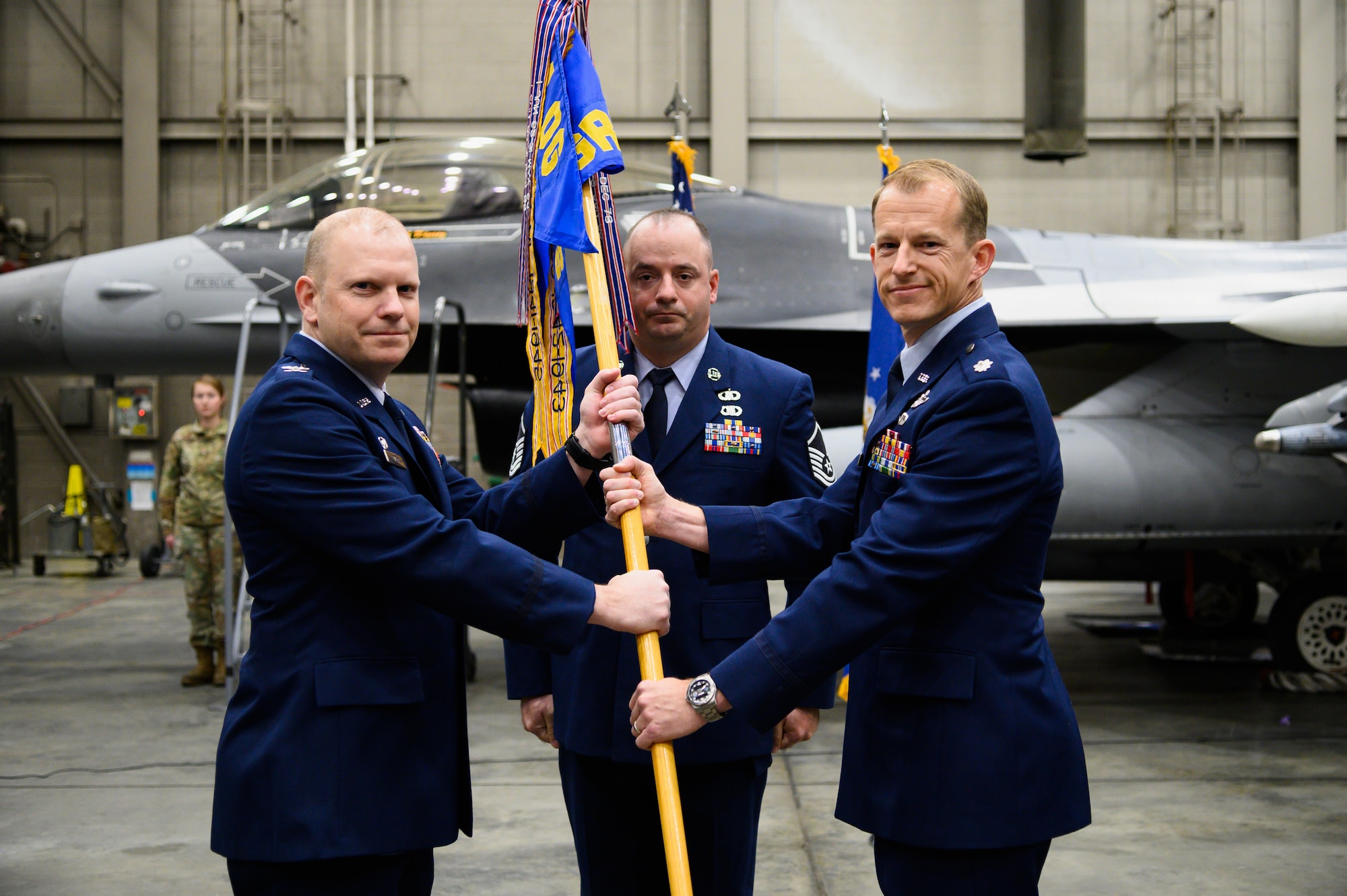U.S. Air Force Col. Lawrence Evert, the 354th Operations Group commander (left), and Lt. Col. Randolph Kinsey, outgoing 18th Aggressor Squadron commander, pose for a photo during an 18th AGRS change of command ceremony on Eielson Air Force Base, Alaska, April 22, 2022.