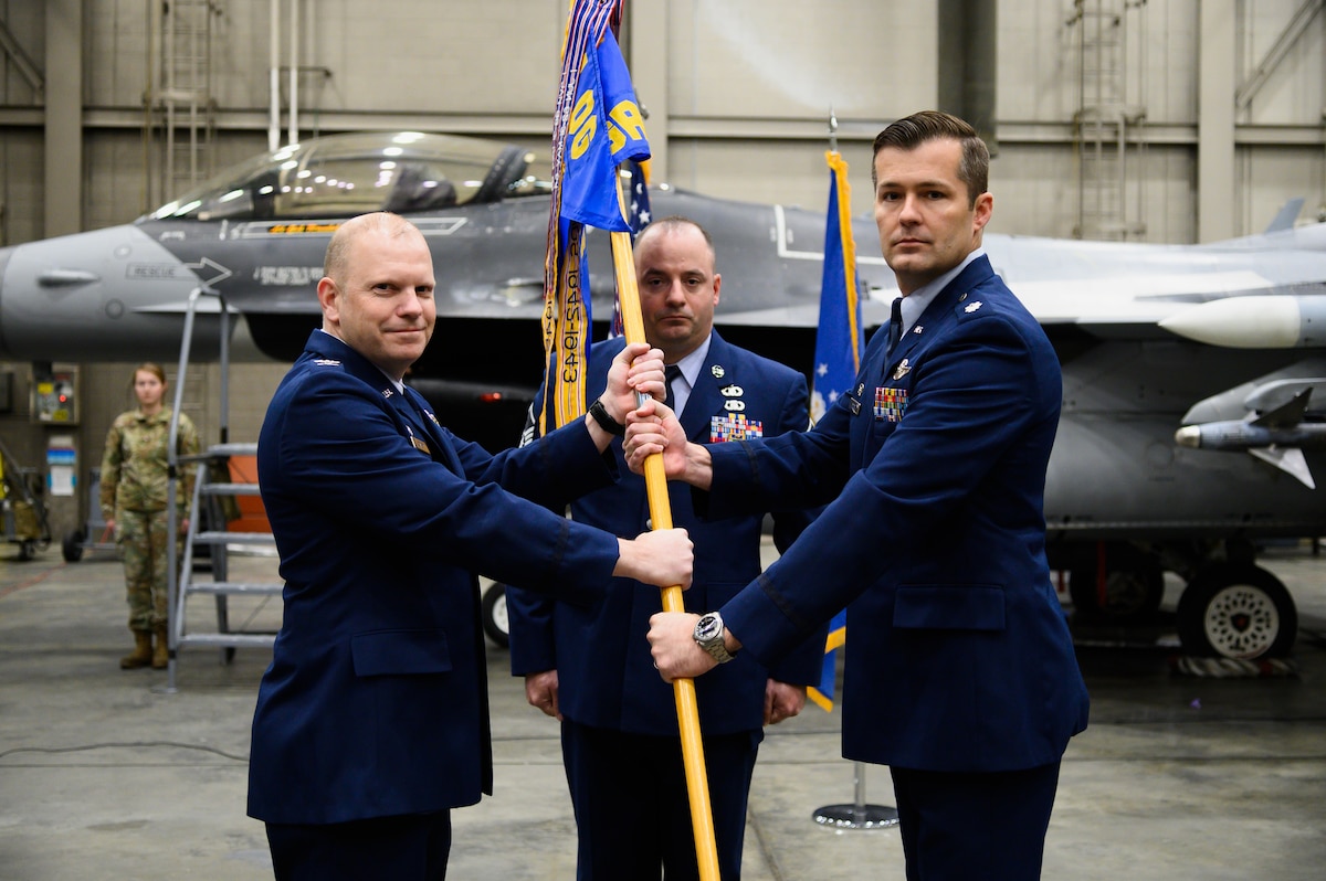 U.S. Air Force Col. Lawrence Evert, the 354th Operations Group commander (left), and Lt. Col. Albert Roper, the 18th Aggressor Squadron commander, pose for a photo during an 18th AGRS change of command ceremony on Eielson Air Force Base, Alaska, April 22, 2022.