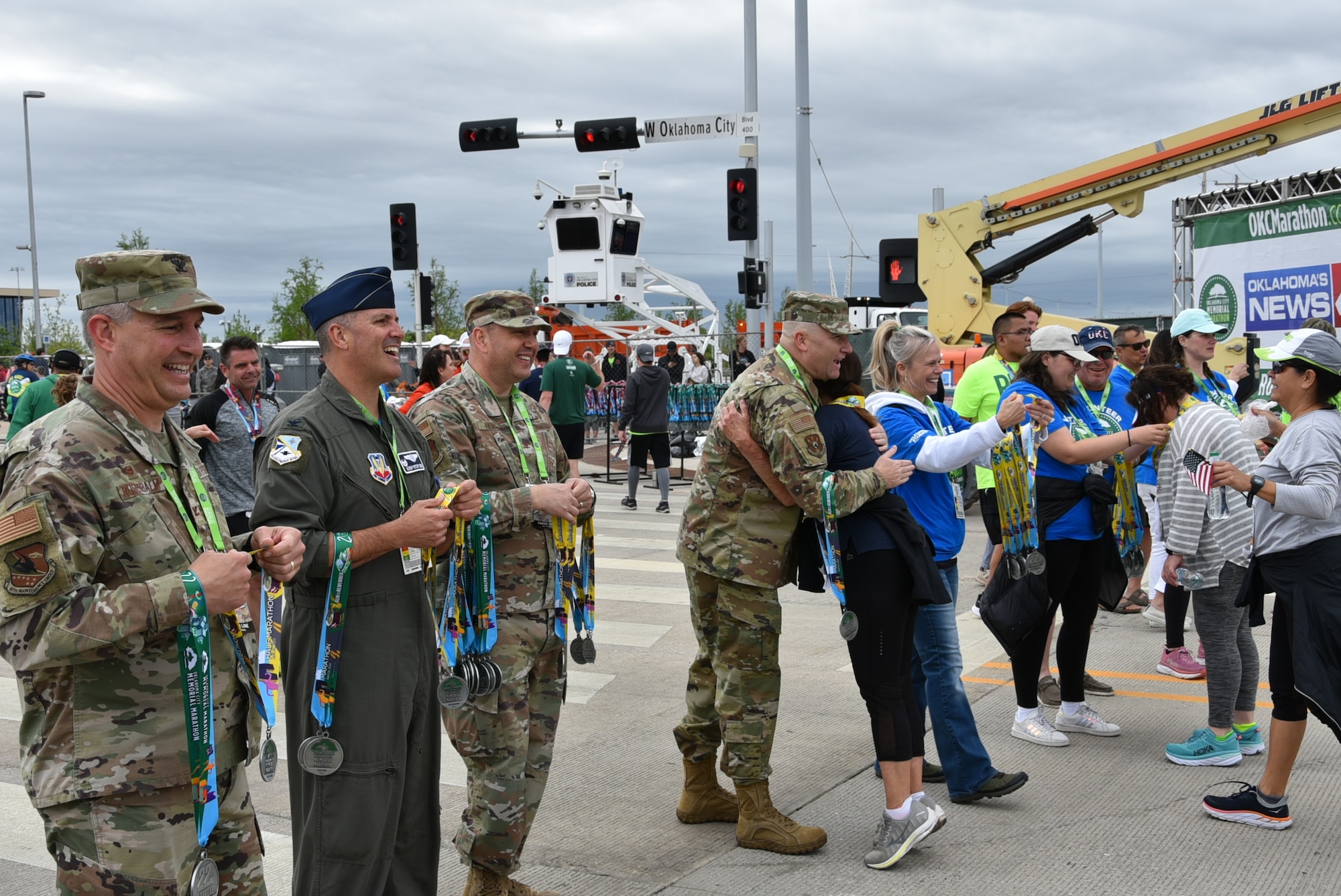 Tinker Air Force Base senior leaders handed out medals to runners at the finish line of the Oklahoma City Memorial Marathon April 24, 2022.