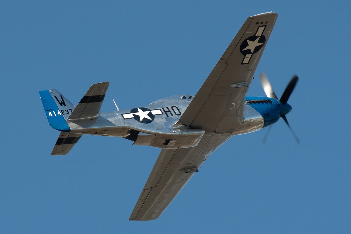 A P-51D Mustang performs an aerial demonstration over the Ohio River in downtown Louisville, Ky., April 23, 2022 as part of the Thunder Over Louisville air show. This year’s event celebrated the 75th anniversary of the United States Air Force. (U.S. Air National Guard photo by Dale Greer)