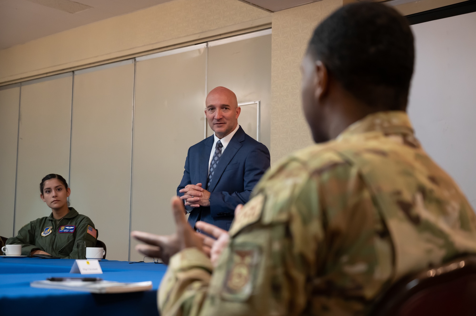 Airman speaking to distinguished visitor