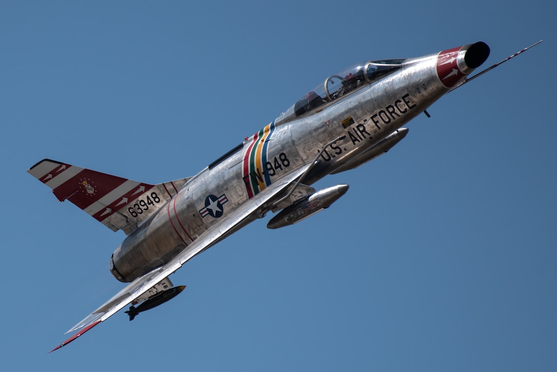 An F-100 Super Sabre performs an aerial demonstration over the Ohio River in downtown Louisville, Ky., April 23, 2022 as part of the Thunder Over Louisville air show. This year’s event celebrated the 75th anniversary of the United States Air Force. (U.S. Air National Guard photo by Dale Greer)