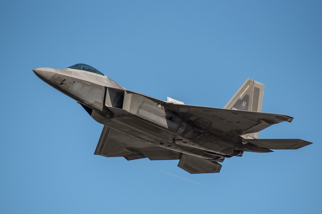 The U.S. Air Force F-22 Raptor Demo Team from the 1st Fighter Wing at Langley Air Force Base, Va., performs an aerial demonstration over the Ohio River in downtown Louisville, Ky., April 23, 2022 as part of the Thunder Over Louisville air show. This year’s event celebrated the 75th anniversary of the United States Air Force. (U.S. Air National Guard photo by Dale Greer)