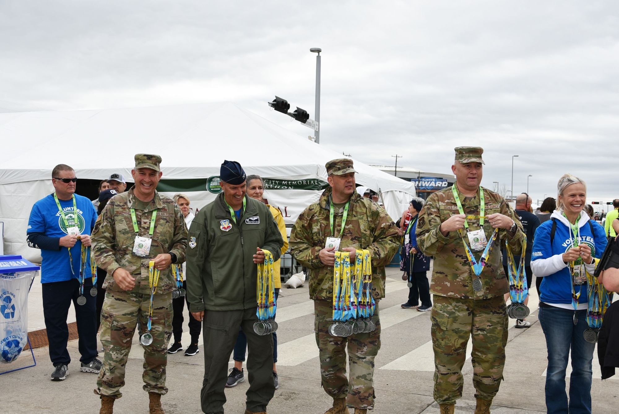 Tinker Air Force Base senior leaders handed out medals to runners at the finish line of the Oklahoma City Memorial Marathon April 24, 2022.