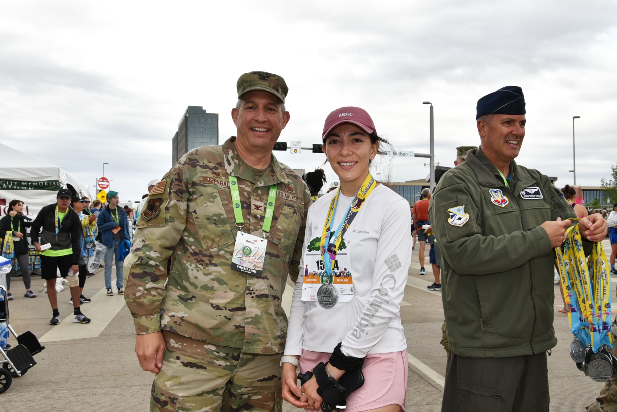 Tinker Air Force Base senior leaders handed out medals to runners at the finish line of the Oklahoma City Memorial Marathon April 24, 2022.