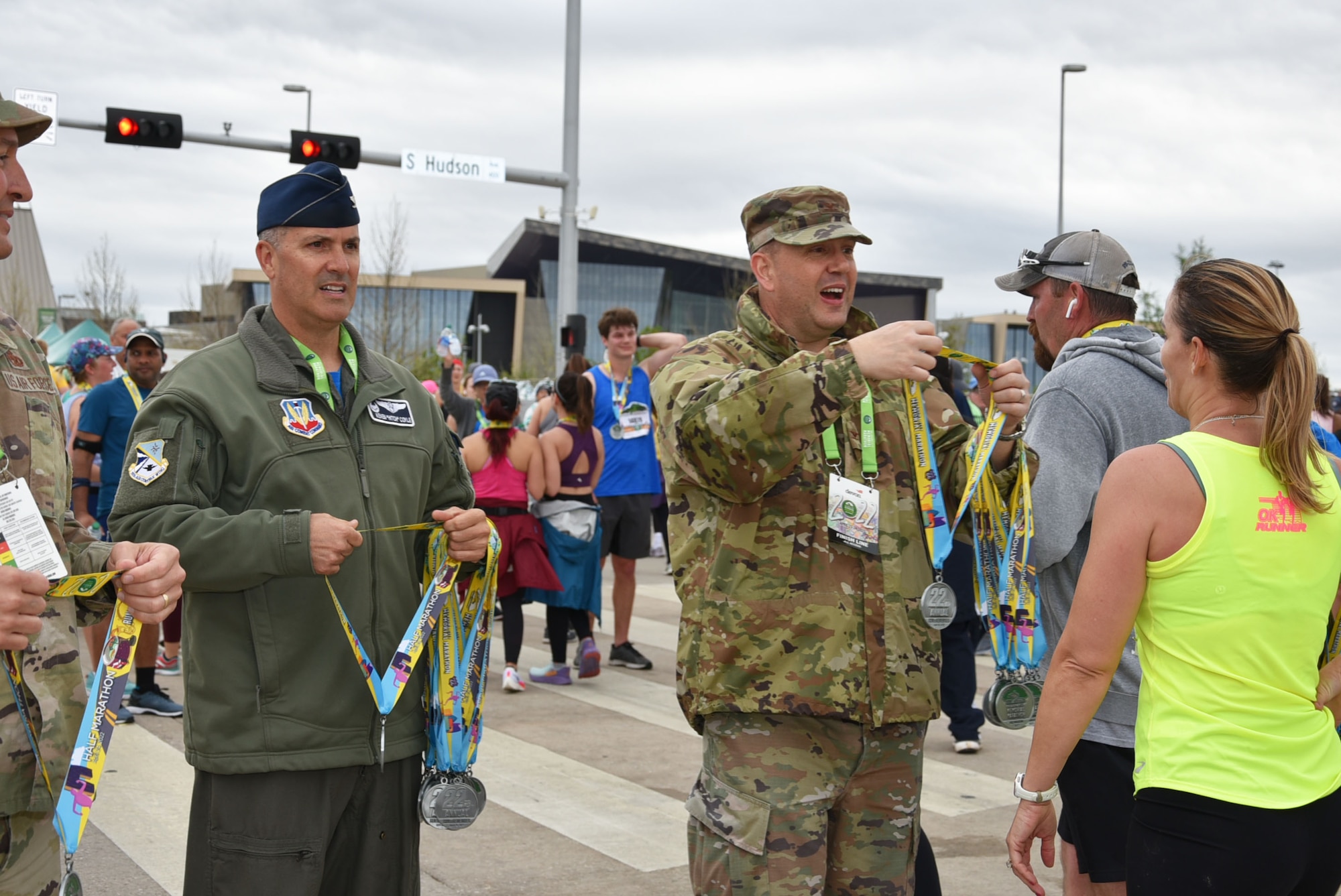 Tinker Air Force Base senior leaders handed out medals to runners at the finish line of the Oklahoma City Memorial Marathon April 24, 2022.