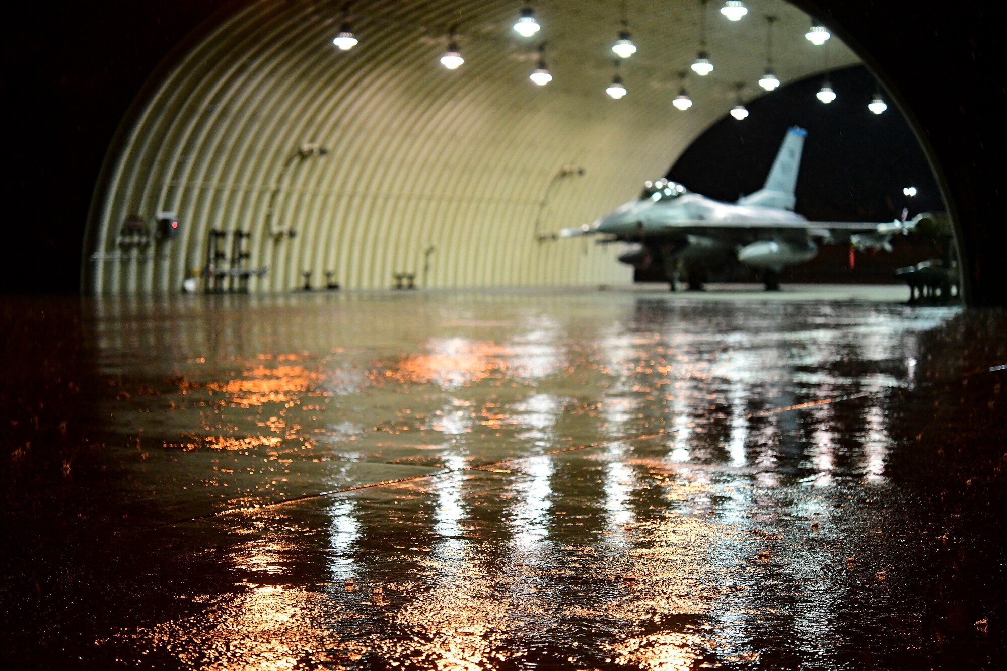 Thunderstorm rain falls over aircraft flows during routine training at Kunsan Air Base, Republic of Korea, April 25, 2022.