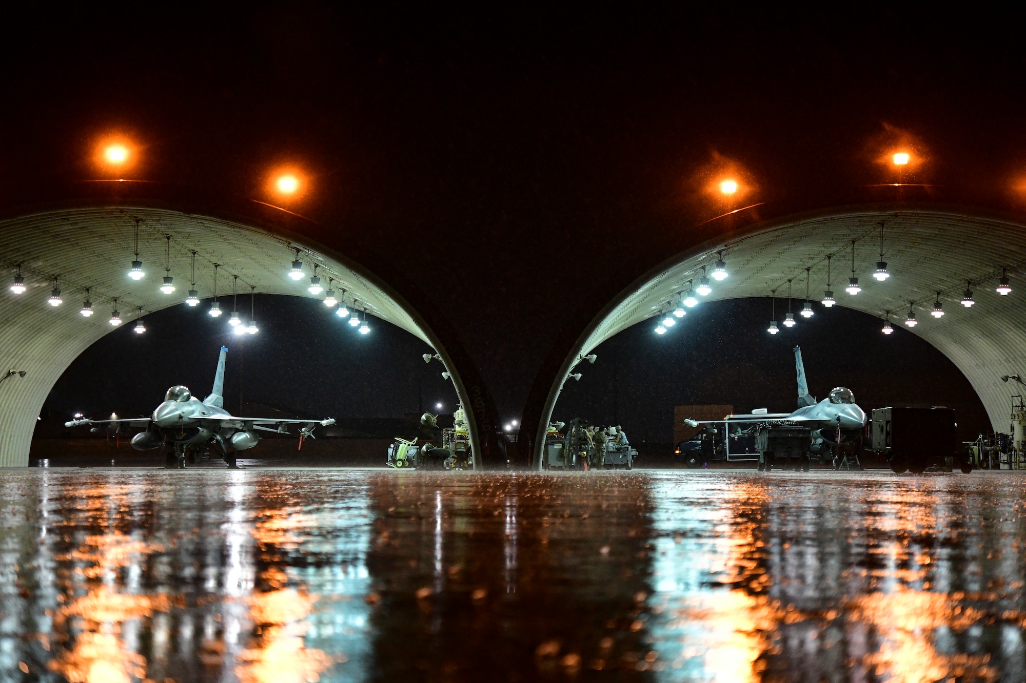 Thunderstorm rain falls over aircraft flows during routine training at Kunsan Air Base, Republic of Korea, April 25, 2022.