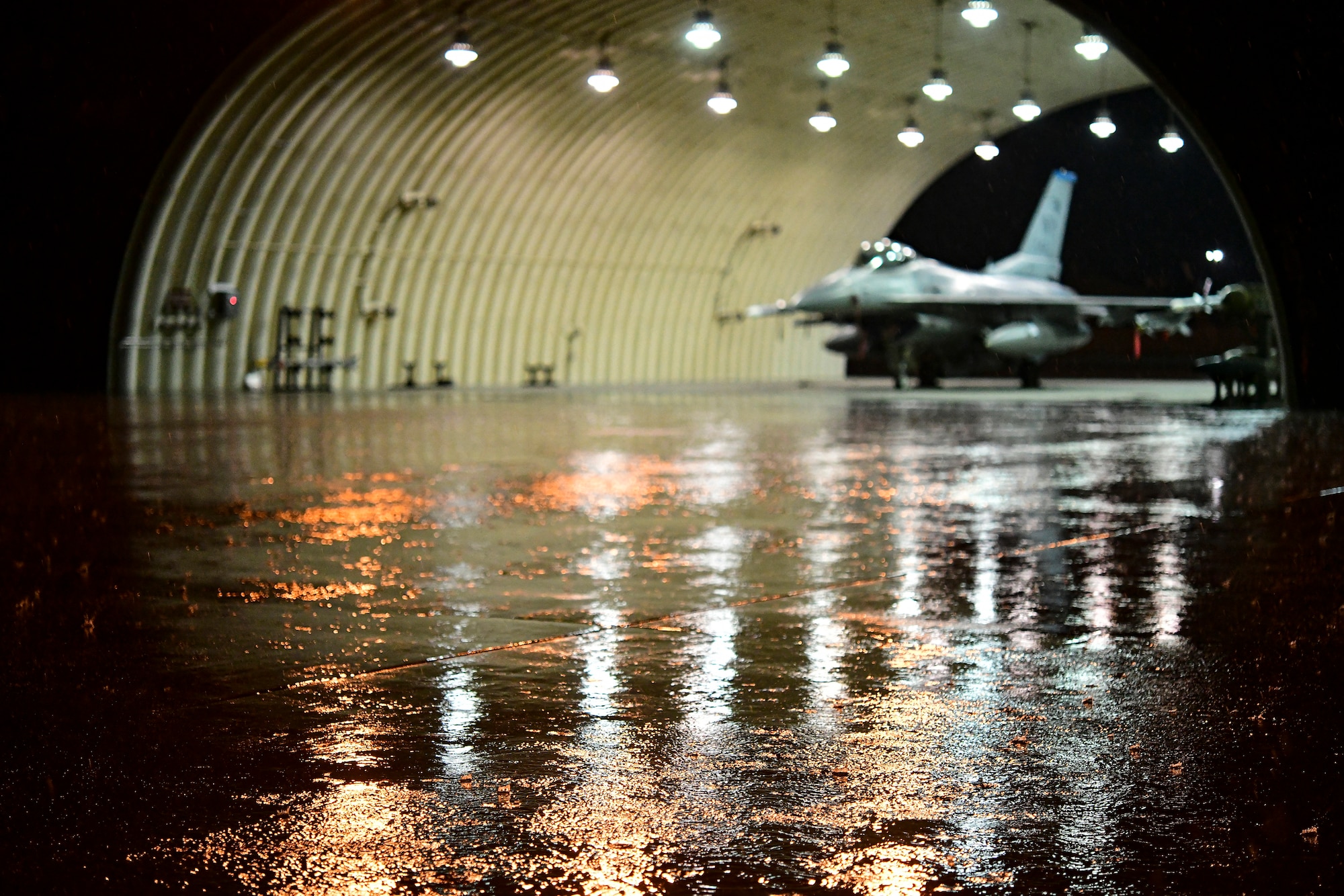 Thunderstorm rain falls over aircraft flows during routine training at Kunsan Air Base, Republic of Korea, April 25, 2022.