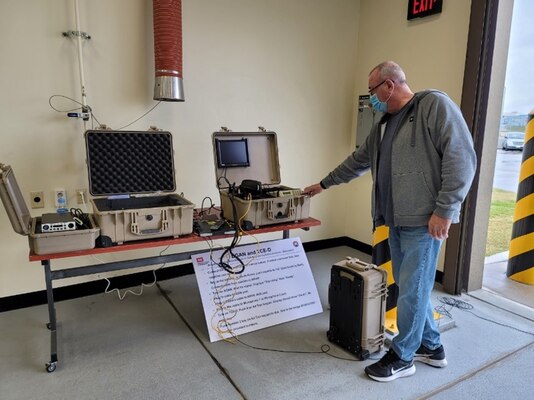 Jerome Giefer, an operations specialist from the U.S. Army Engineer Research and Development Center (ERDC), demonstrates how to dial on a Tele-Engineering Communications Deployable device, during communications training at the FED motor pool, April 14. (U.S. Army photo by Yohan An)