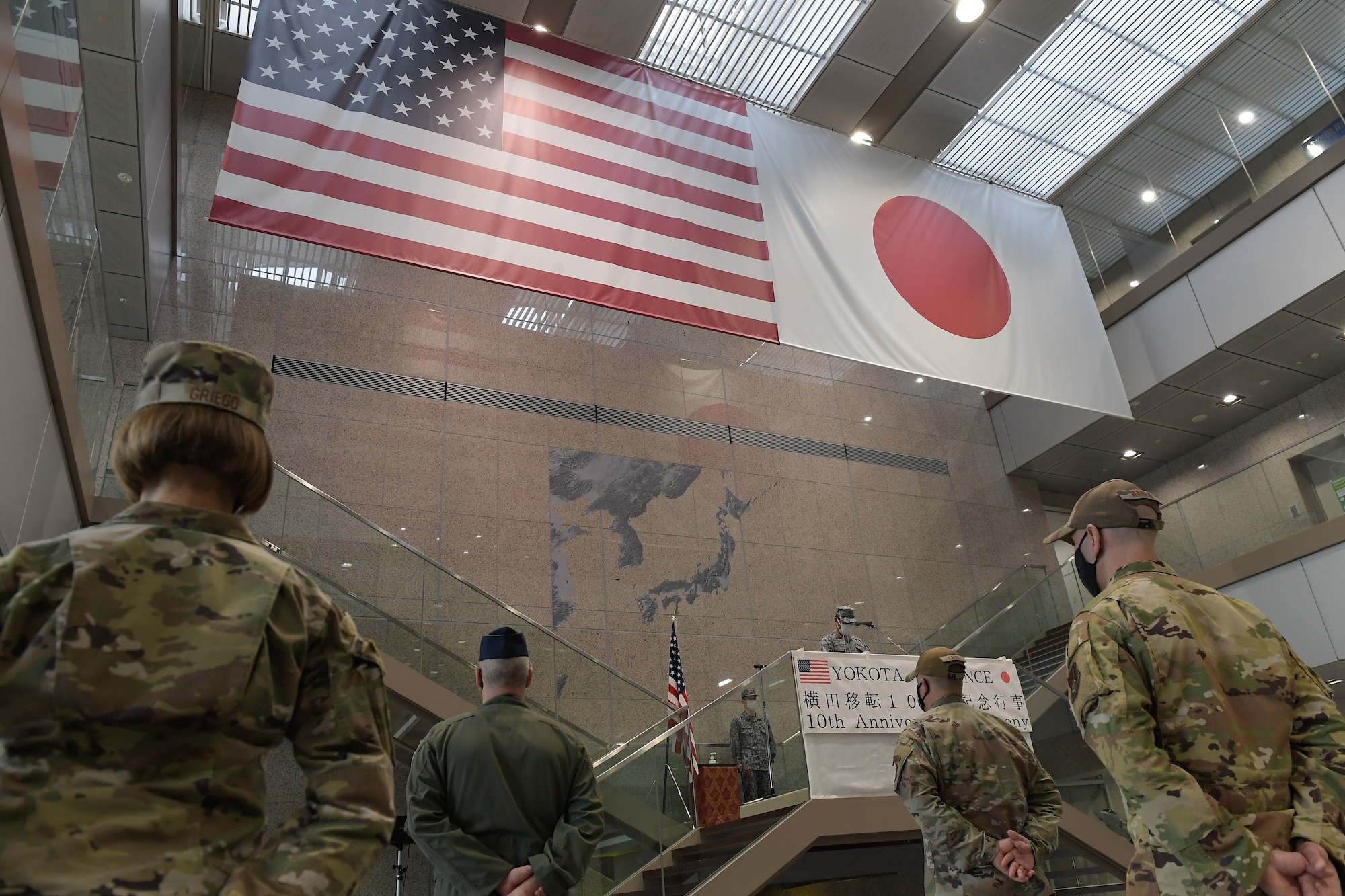 Japan Air Self-Defense Force (Koku-Jieitai) Col. Takashi Izuhara, Operations Support Wing commander, gives opening remarks at the 10th anniversary ceremony of the JASDF relocation of the Air Defense Command to Yokota Air Base, Japan, April 20, 2022.