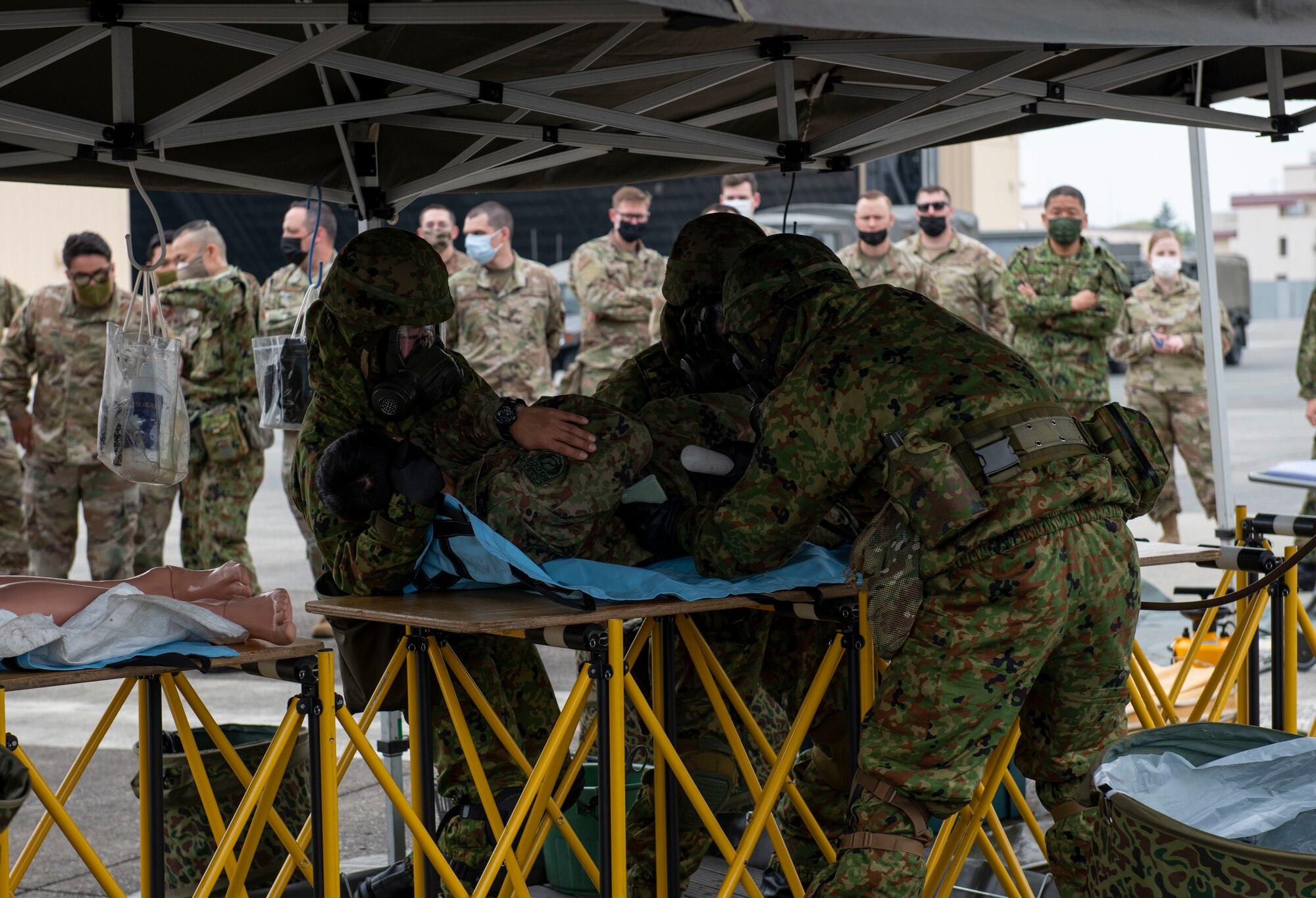 Japan Ground Self-Defense Force Central Biological Chemical Weapons Defense Unit soldiers demonstrate decontamination procedures