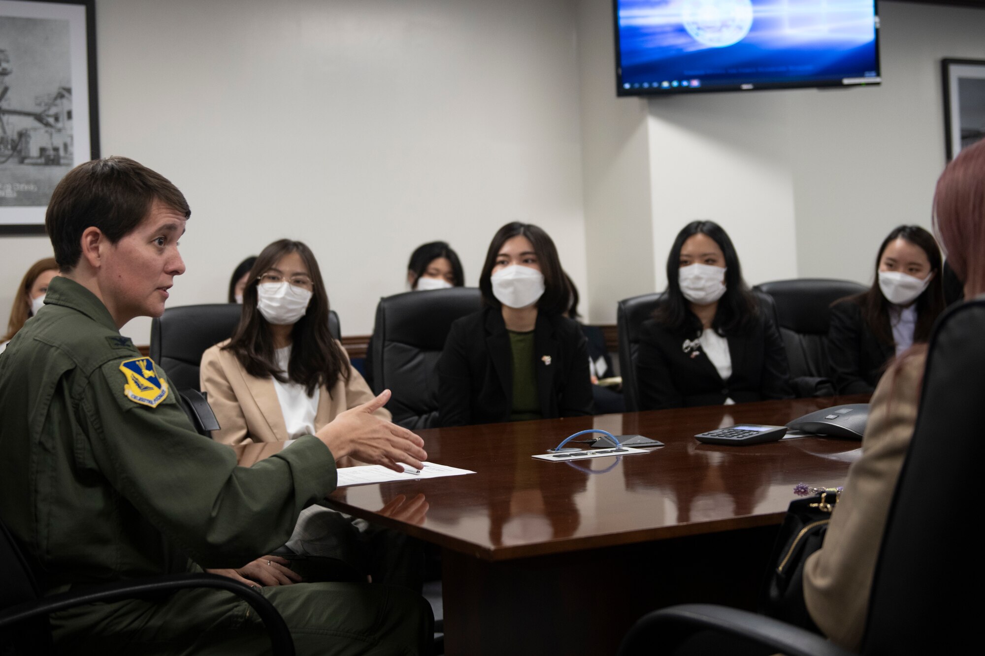 Col. Julie Gaulin, 374th Airlift Wing vice commander, left, welcomes the Ambassador’s Youth Council and provides opening remarking for a base tour at Yokota Air Base, Japan, April 22, 2022. Gaulin explained to the group the importance of Yokota Air Base and the partnership with the Japan Air Self-Defense Force. (U.S. Air Force photo by Tech. Sgt. Joshua Edwards)