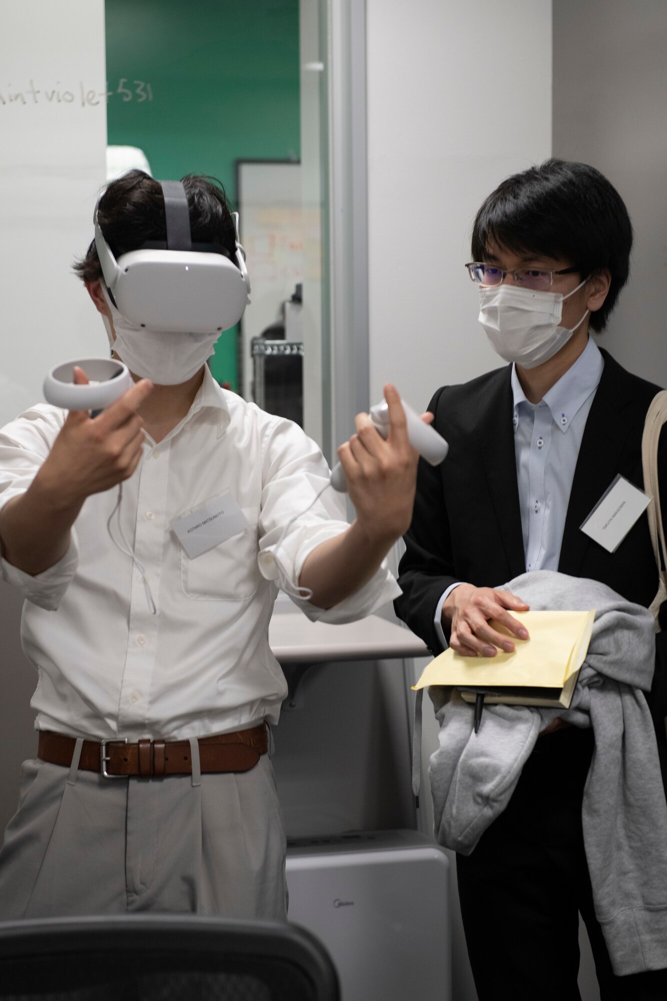 Kotaro Matsumoto, Ambassador’s Youth Council member, left, tries the virtual reality system at YokoWerx during an AYC tour at Yokota Air Base, Japan, April 22, 2022. AYC, run by the American Consulate General Osaka-Kobe, came to the base to see how Yokota operates in Japan and how it partners with the Japan Air Self-Defense Force. (U.S. Air Force photo by Tech. Sgt. Joshua Edwards)