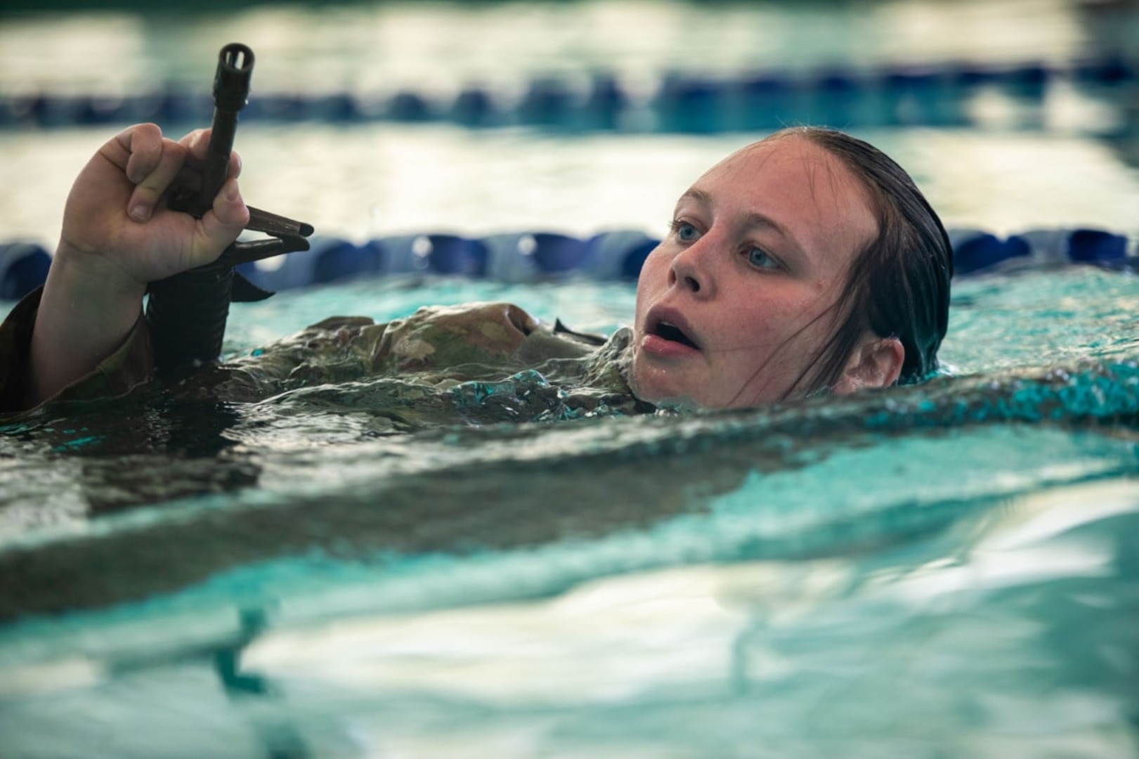 2nd Lt. Margaret Dean, Charlie Company, 3rd Battalion, 172nd Infantry Regiment (Mountain), conducts the combat water survival test as part of the 2022 NHNG Ranger Assessment in Concord, New Hampshire, on April 8.