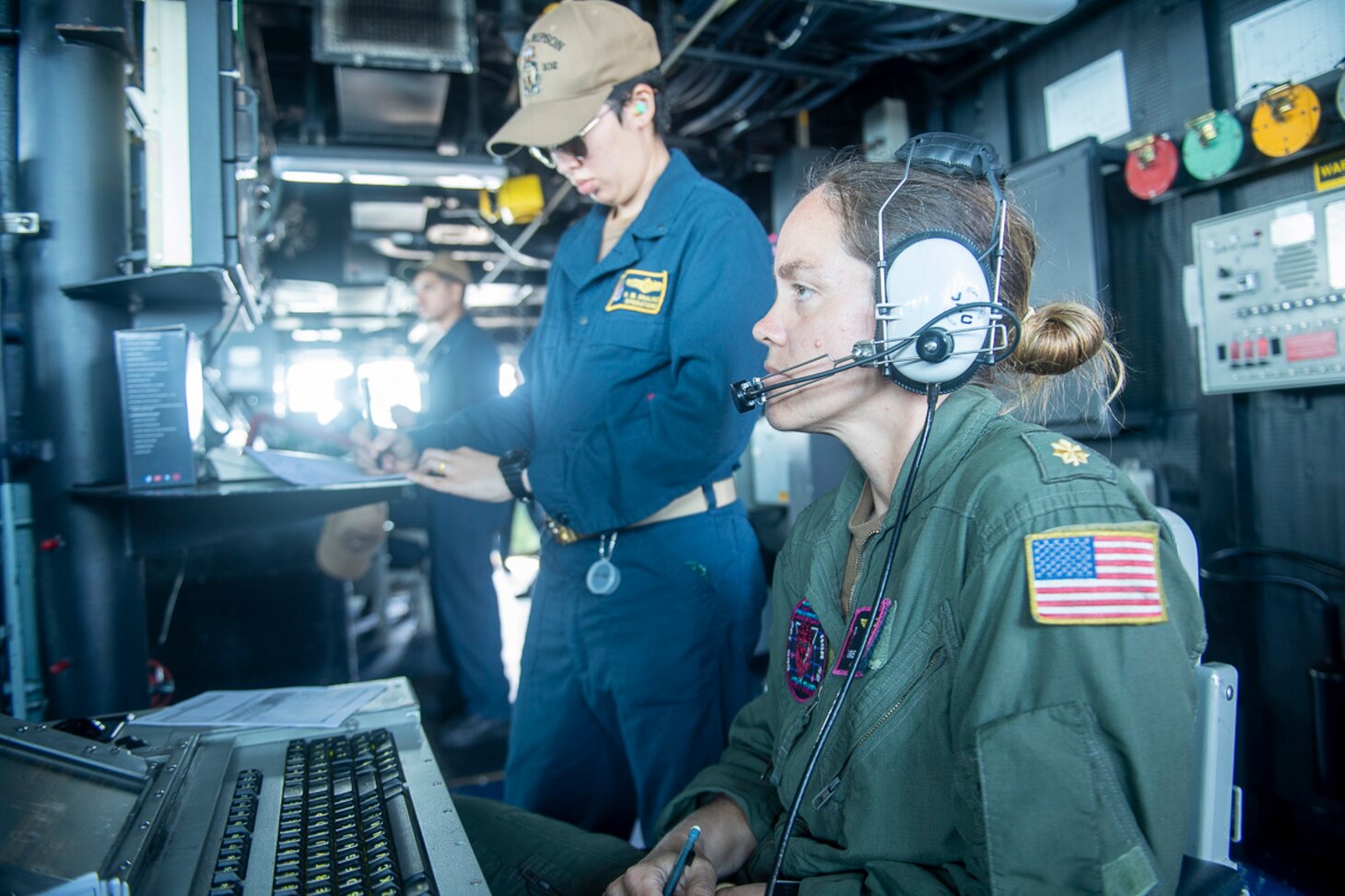 220426-N-CD319-1052 TAIWAN STRAIT (APR. 26, 2022) Lt. Cmdr. Kristina Mullins stands watch on the bridge aboard the Arleigh Burke-class guided-missile destroyer USS Sampson (DDG 102) while it transits the Taiwan Strait. USS Sampson is forward-deployed to the U.S. 7th Fleet area of operations in support of a free and open Indo-Pacific. (U.S. Navy photo by Mass Communications Specialist 3rd Class Tristan Cookson)