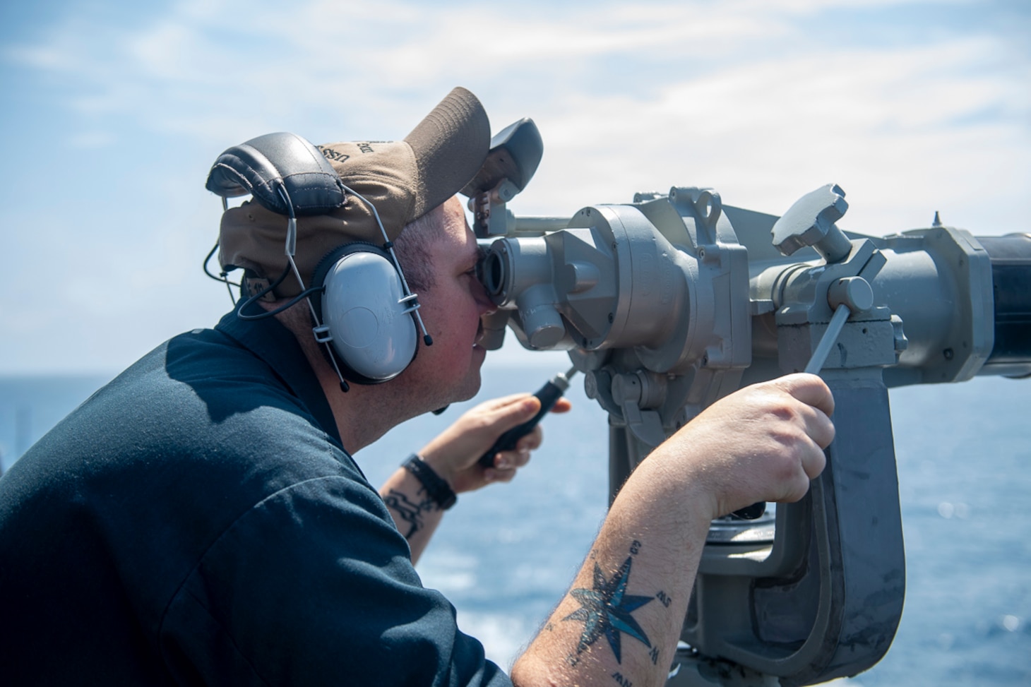 220426-N-CD319-1117 TAIWAN STRAIT (APR. 26, 2022) Boatswain’s Mate 2nd Class Jon Eimer stands watch on the bridge aboard the Arleigh Burke-class guided-missile destroyer USS Sampson (DDG 102) while it transits the Taiwan Strait. USS Sampson is forward-deployed to the U.S. 7th Fleet area of operations in support of a free and open Indo-Pacific. (U.S. Navy photo by Mass Communications Specialist 3rd Class Tristan Cookson)