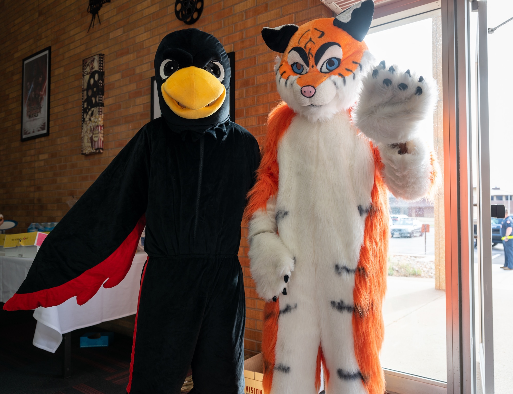 Mascots from the 34th and 37th Bomb Squadrons attend a dedicated crew chief ceremony at Ellsworth Air Force Base, S.D., April 22, 2022. The 34th BS is known as the Thunderbirds, while the 37th BS is known as the Tigers. (U.S. Air Force photo by Senior Airman Michael Ward)