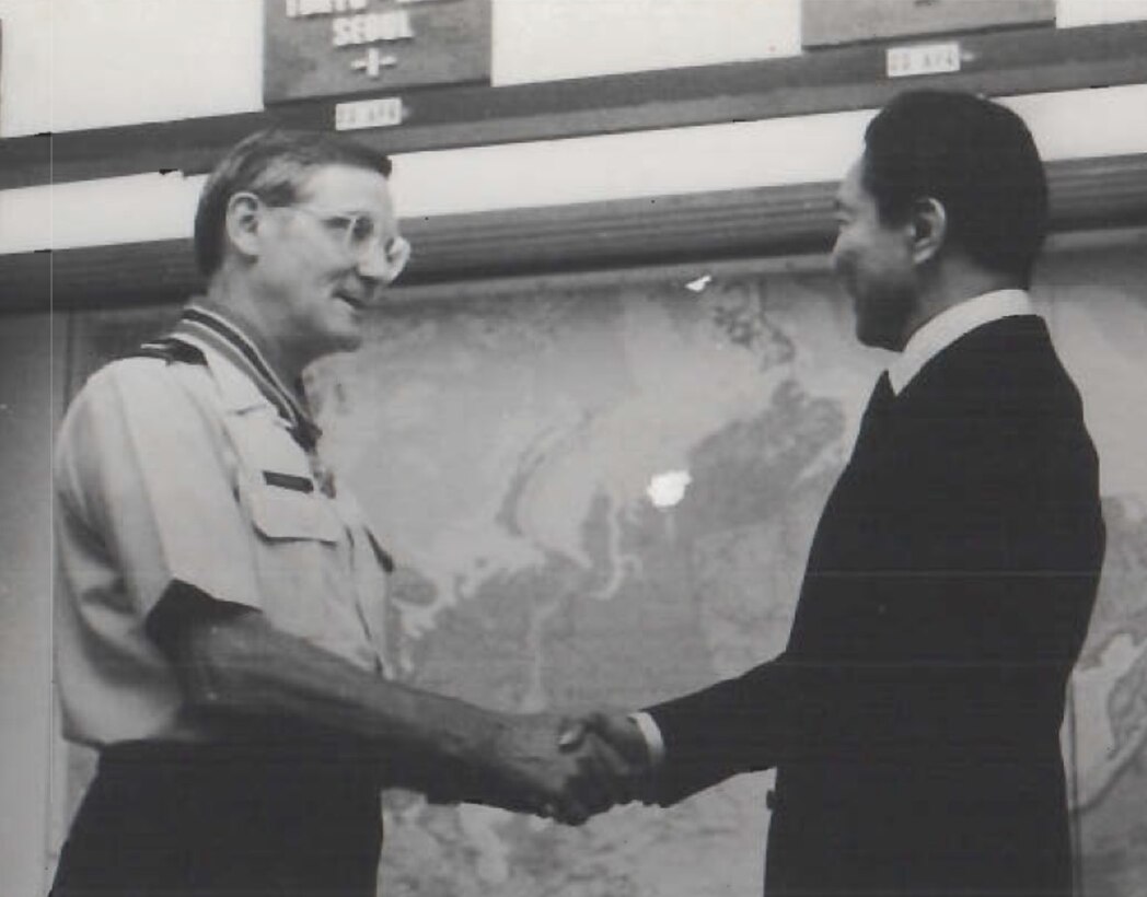 Col. Forest A. Singhoff, OSI Commander, receives a decoration from Philippine President Ferdinand Marcos in Hawaii in 1979 (U.S. Air Force photo).