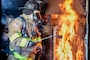 Naval Support Activity (NSA) Naples Fire Captain Donnie Woods ignites pallets and hay in preparation for a live fire training exercise on board NSA Naples’ Support Site, June 26, 2020.
