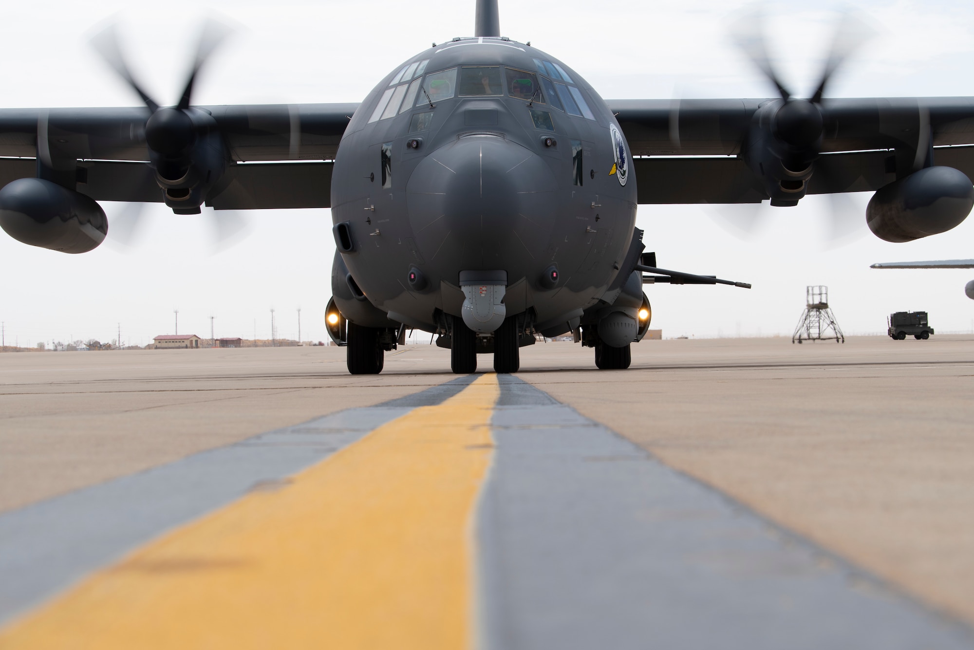 A U.S. Air Force 16th Special Operations Squadron AC-130J Ghostrider arrives at Cannon Air Force Base, New Mexico, April 18, 2022. The arrival of the AC-130J Ghostrider represents a significant expansion of force generation capacity as the Air Force Special Operations Command structures for the reemergence of great power competition, demanding significant transformation to ensure Air Commandos are ready to successfully operate in full-spectrum operations. (U.S. Air Force photo by Airman 1st Class Cassidy Thomas) (This photo has been altered for security purposes by blurring out identification numbers and equipment)
