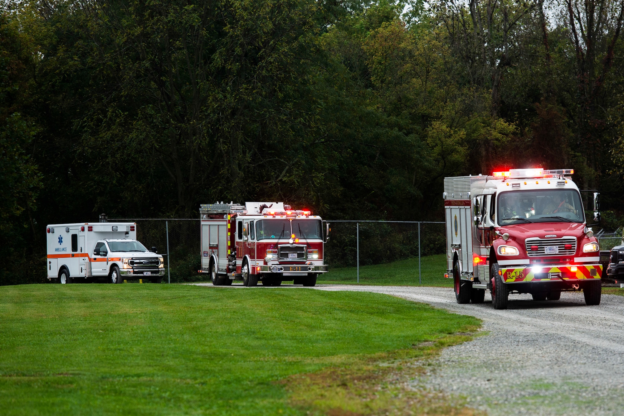 First responders arrive on scene at a simulated C-17 aircraft crash as part of a base exercise, at Wright-Patterson Air Force Base, Ohio. Readiness exercises are routinely held to streamline unit cohesion when responding to emergencies. (U.S. Air Force photo by Wesley Farnsworth)