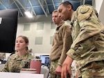 Members of the West Virginia Army National Guard collaborate on a scenario inject during a simulated cyber-attack as a part of Locked Shields 2022. More than 75 participants from the various federal and state agencies competed on behalf of the United States team in the world’s largest international cyber defense exercise run virtually by the NATO Cooperative Cyber Defence Centre of Excellence in Tallinn, Estonia, April 19-21, 2022. The West Virginia-led U.S. team finished 15th overall out of 24 international teams. (U.S. Air National Guard photo by Maj. Holli Nelson)