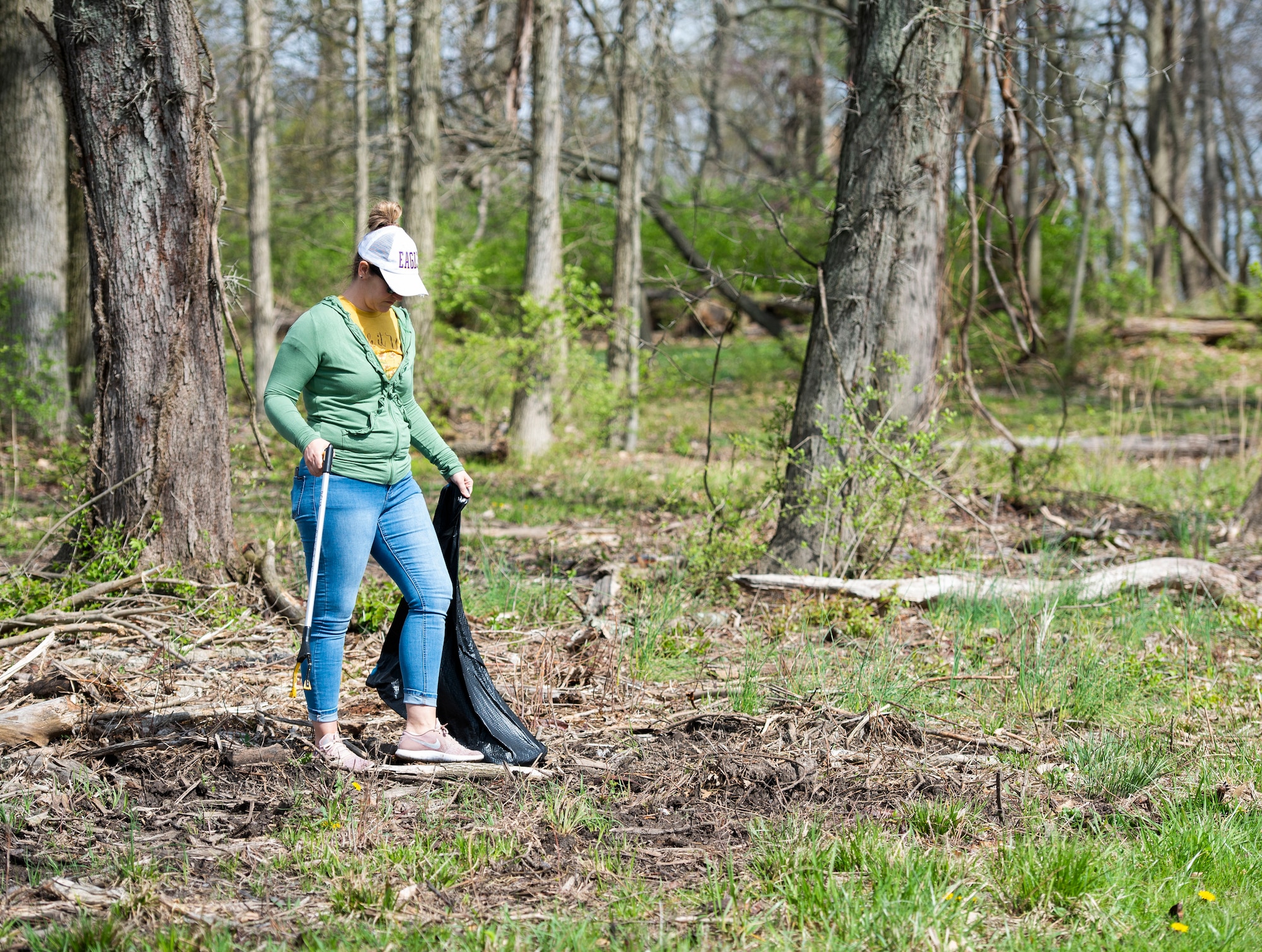 A member of Team Wright-Patt participate in an Earth Day event hosted by Wright-Patterson Air Force Base the City of Fairborn and the Beavercreek Wetlands Association at the Community Park in, Fairborn, Ohio, April 22, 2022. During the event volunteers picked up trash and debris in order to clean up the park. (U.S. Air Force photo by Wesley Farnsworth)