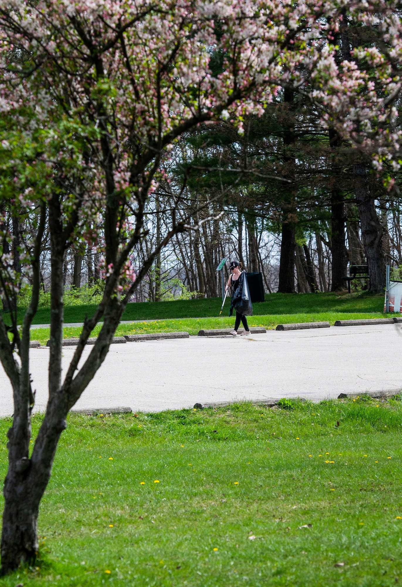 A member of Team Wright-Patt participate in an Earth Day event hosted by Wright-Patterson Air Force Base the City of Fairborn and the Beavercreek Wetlands Association at the Community Park in, Fairborn, Ohio, April 22, 2022. During the event volunteers picked up trash and debris in order to clean up the park. (U.S. Air Force photo by Wesley Farnsworth)