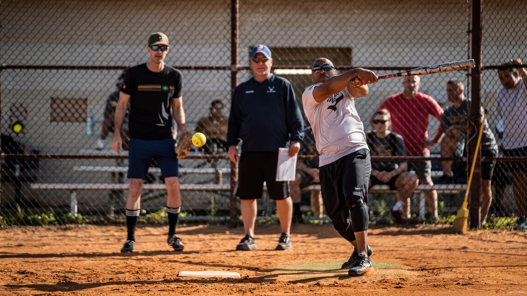 U.S. Airmen assigned to the 6th Air Refueling Wing participate in a softball game during wingman day at MacDill Air Force Base, Florida, April 22, 2022.